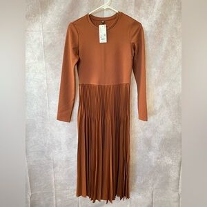 Long sweater dress that has an interesting pleated skirt. Grace meets comfort!